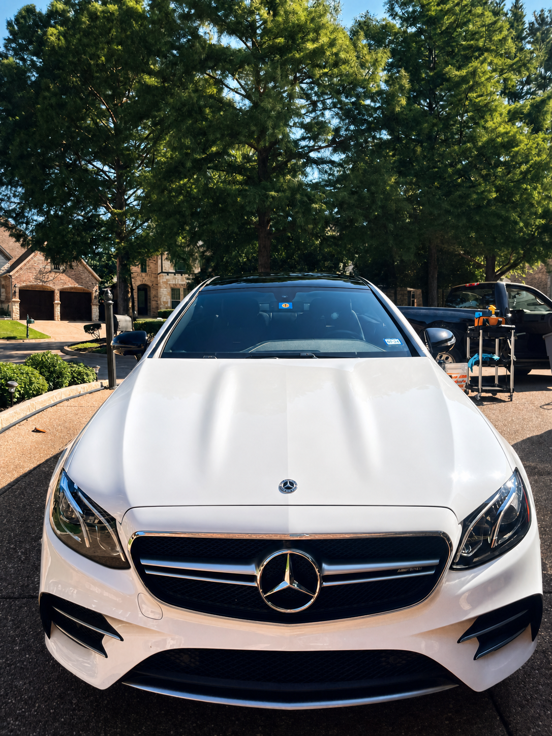 White Mercedes-Benz AMG being professionally detailed